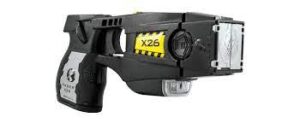 A black x26 taser with silver accents and yellow logo